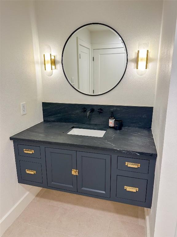 bathroom with vanity and tile patterned flooring