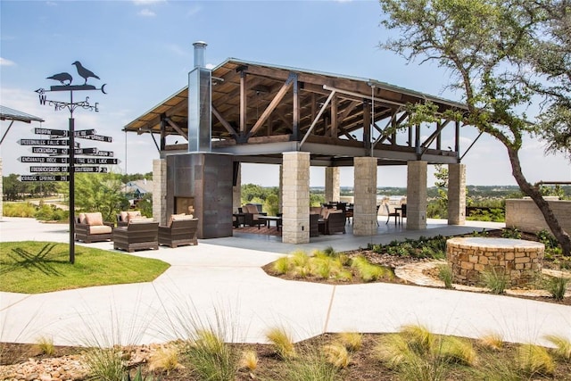 view of community with a gazebo, an outdoor hangout area, and a patio