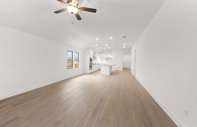 6420 Apache Plum Ln, Spicewood, TX 78669 - unfurnished living room featuring lofted ceiling, a ceiling fan, light wood finished floors, and recessed lighting