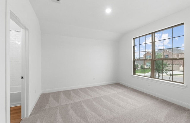 6420 Apache Plum Ln, Spicewood, TX 78669 - spare room featuring light colored carpet, lofted ceiling, and recessed lighting