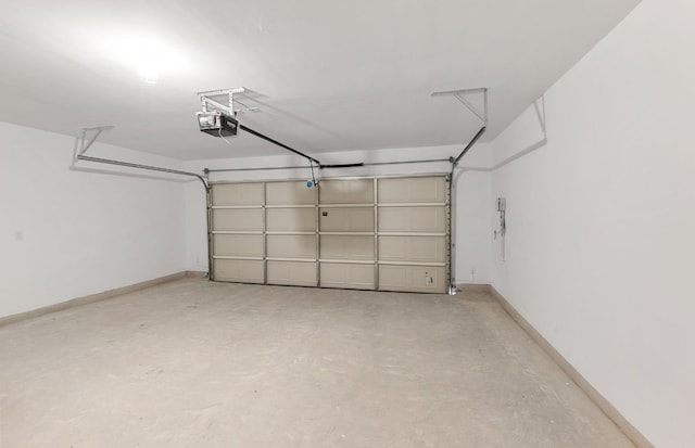 6420 Apache Plum Ln, Spicewood, TX 78669 - garage featuring a garage door opener and baseboards