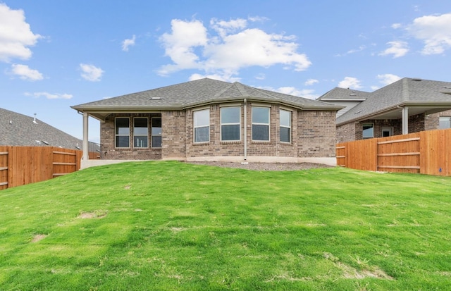 6420 Apache Plum Ln, Spicewood, TX 78669 - back of house with brick siding and a fenced backyard