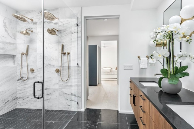 bathroom with vanity and a shower with shower door