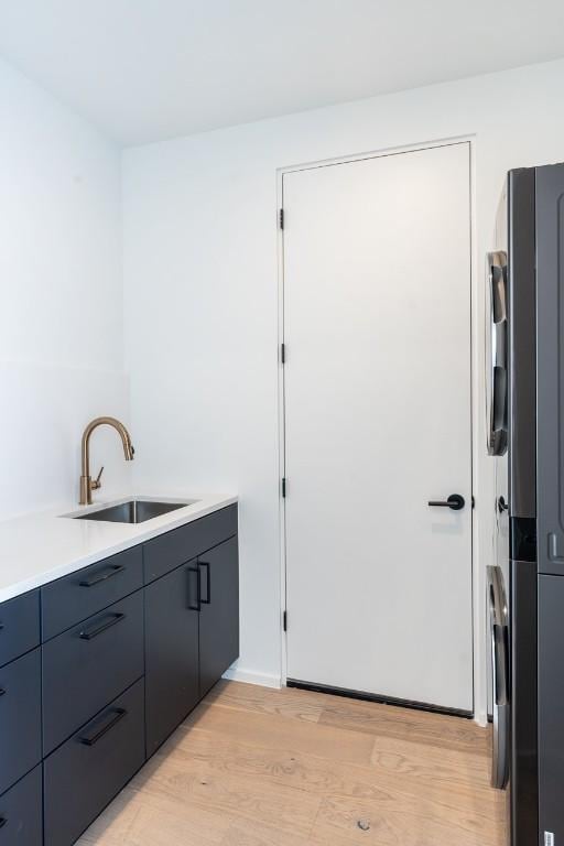 interior space with sink and light hardwood / wood-style floors