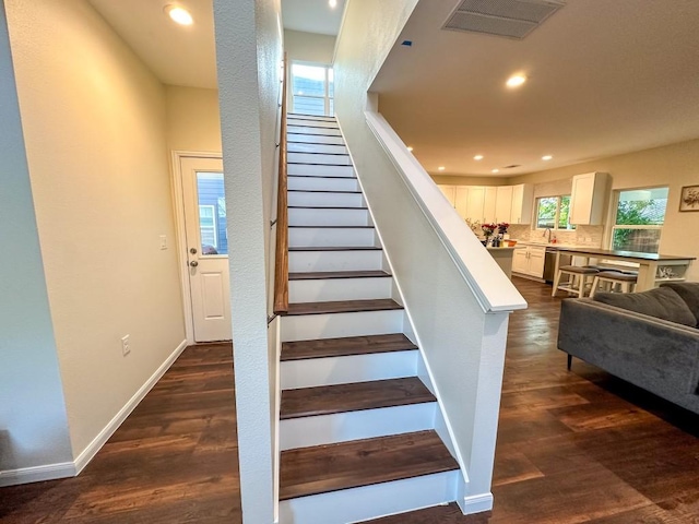 803 4th St, Lockhart, TX 78644 - stairway featuring recessed lighting, wood finished floors, and baseboards