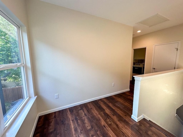 unfurnished room featuring dark hardwood / wood-style flooring