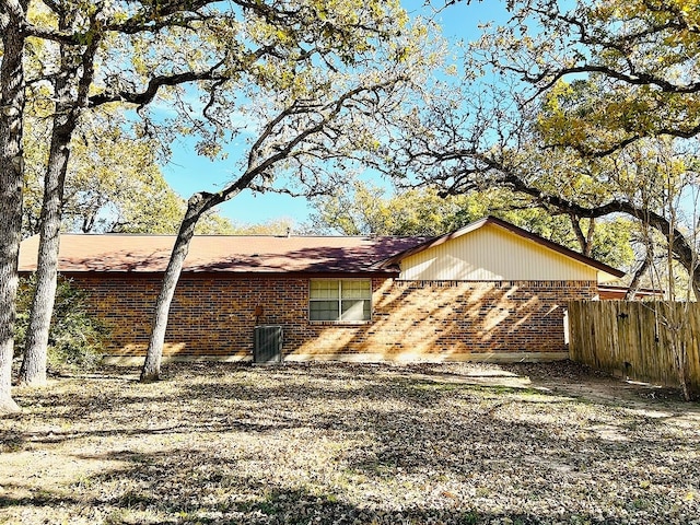 rear view of house with central AC unit