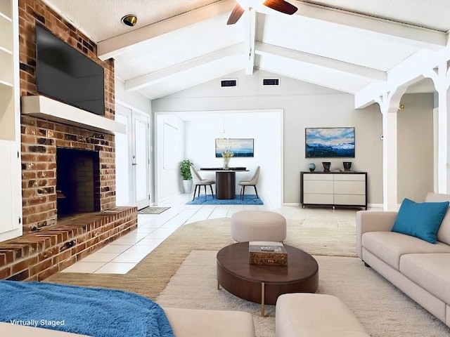 tiled living room with ceiling fan, a fireplace, and lofted ceiling with beams