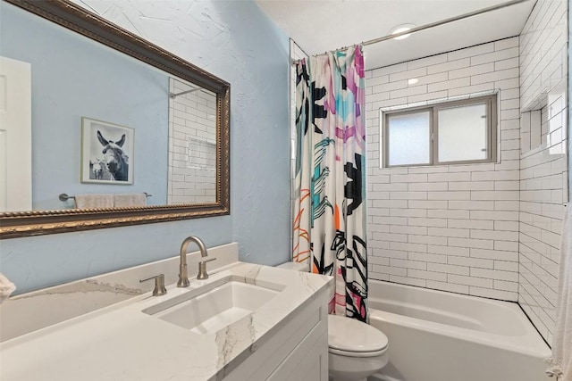 full bathroom with vanity, shower / bath combination with curtain, and toilet