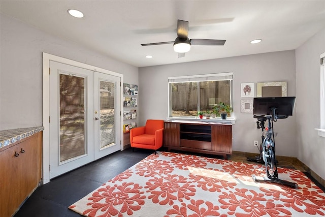 workout room featuring french doors and ceiling fan