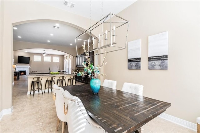 dining area with ceiling fan and light tile patterned floors