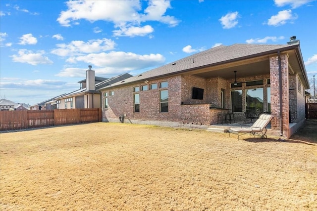 back of house with a patio