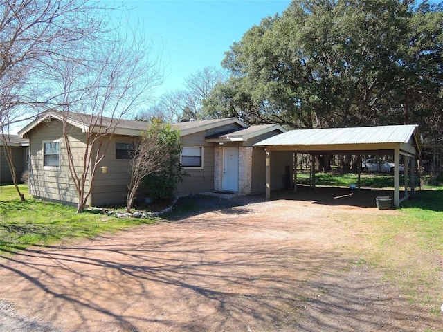 ranch-style home featuring a carport