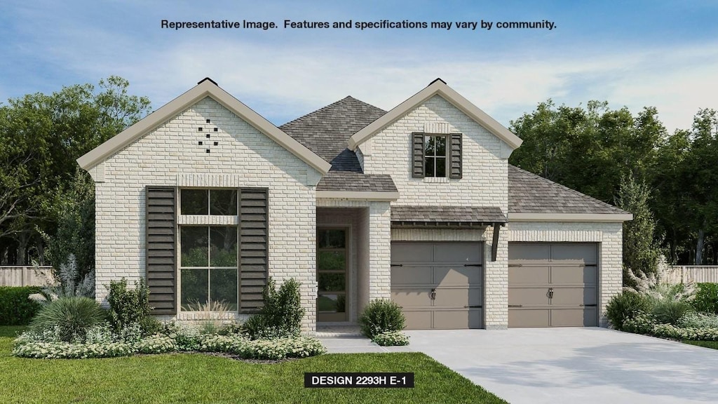 view of front facade with a garage and a front lawn