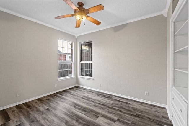 spare room featuring ornamental molding, dark hardwood / wood-style floors, and ceiling fan