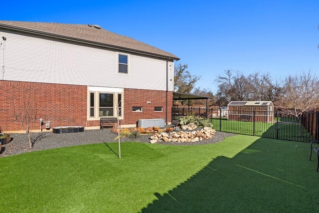 rear view of house with a lawn