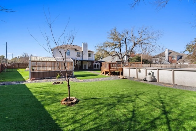 view of yard with an outbuilding and a wooden deck