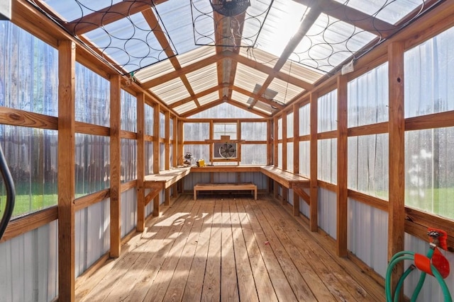 unfurnished sunroom with lofted ceiling and a wealth of natural light