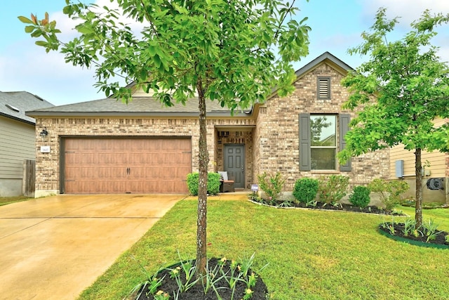7617 Ballydawn Dr, Austin, TX 78744 - view of front facade with an attached garage, brick siding, a front lawn, and concrete driveway