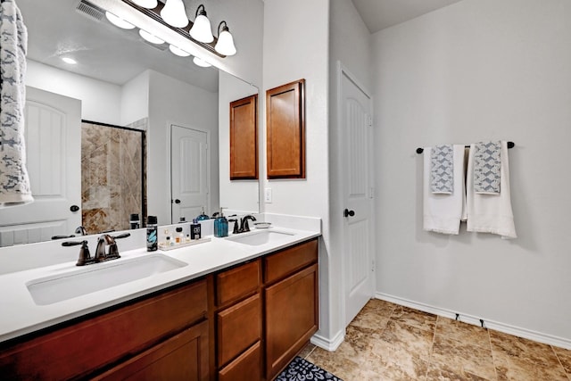7617 Ballydawn Dr, Austin, TX 78744 - full bathroom featuring double vanity, a tile shower, and baseboards
