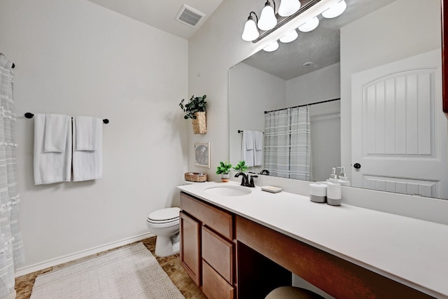 bathroom with walk in shower, vanity, toilet, and a chandelier