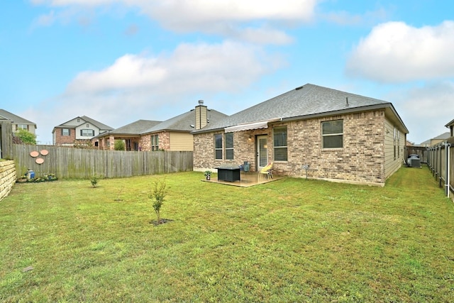 back of property featuring a patio and a lawn