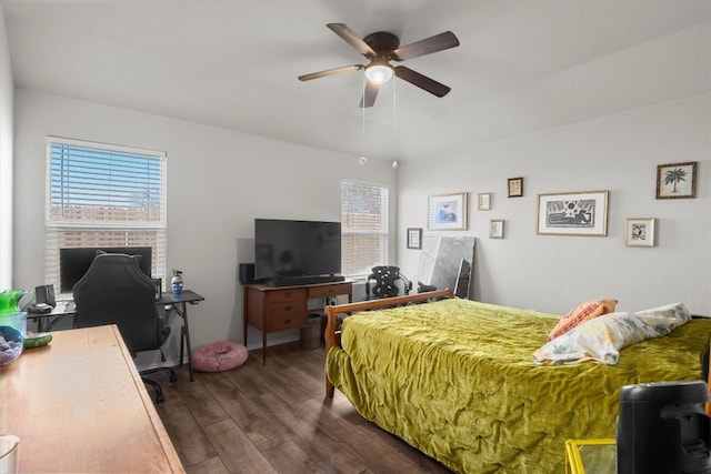 bedroom with ceiling fan and dark wood-type flooring