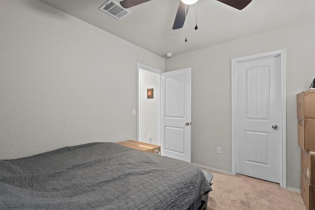 bedroom featuring light colored carpet and ceiling fan