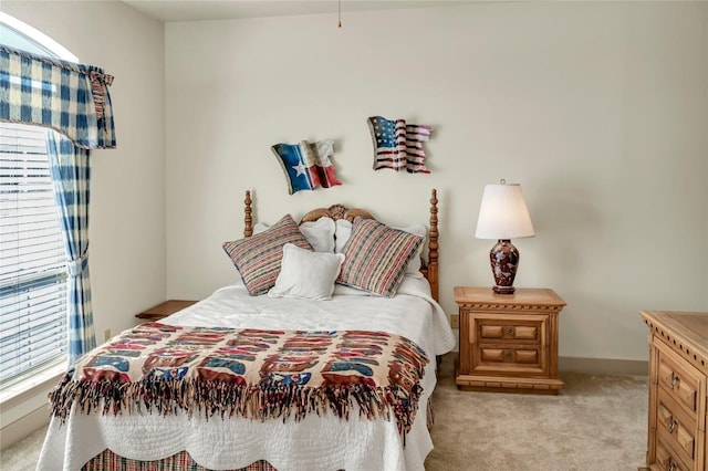 bedroom featuring light carpet