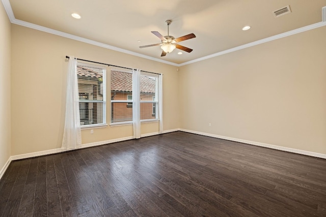 empty room featuring ceiling fan, ornamental molding, and dark hardwood / wood-style flooring