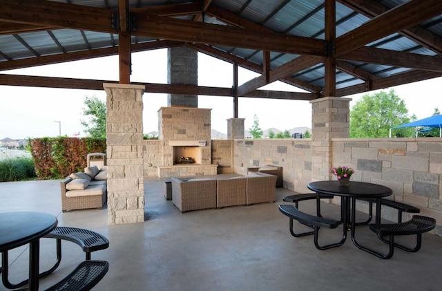 view of patio featuring an outdoor living space with a fireplace