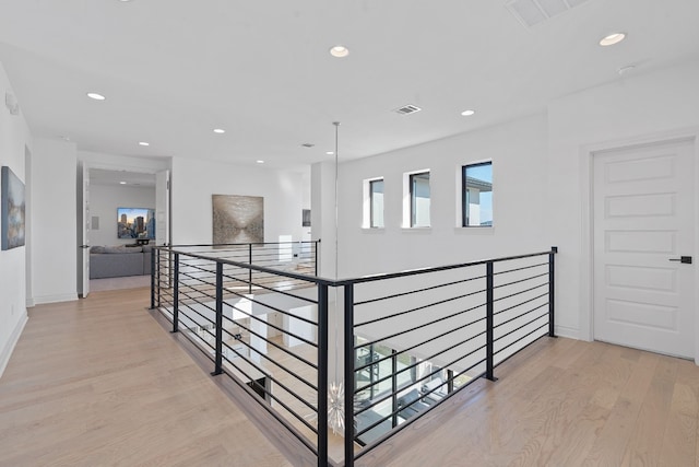 corridor featuring light hardwood / wood-style floors