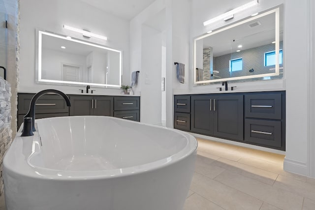 bathroom featuring vanity, tile patterned flooring, and independent shower and bath