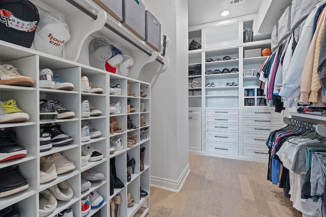 spacious closet featuring light wood-type flooring