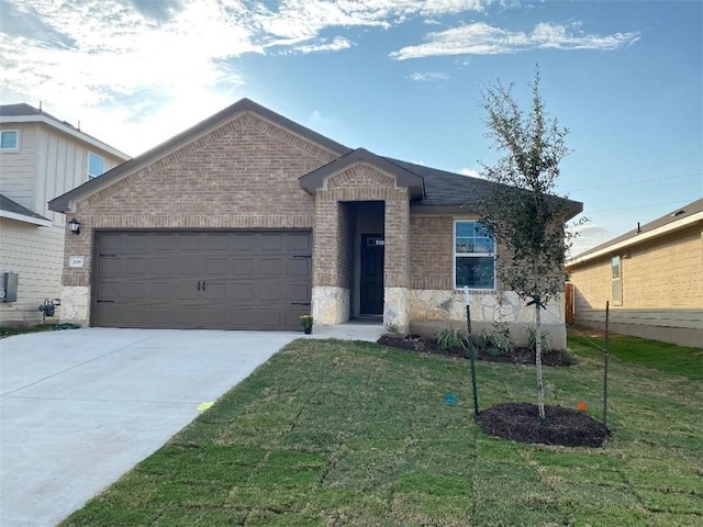 view of front of property with a garage and a front lawn