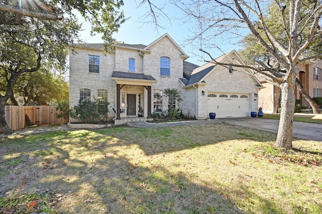 view of front property with a garage and a front yard