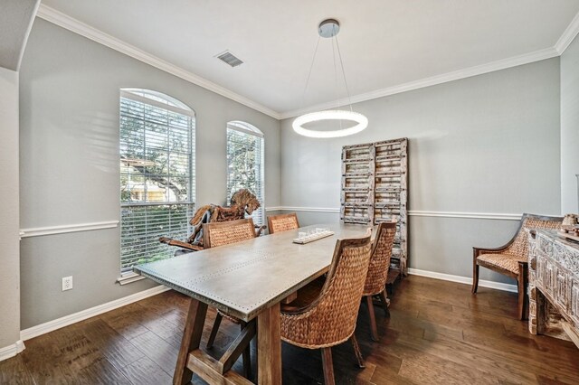 12304 Aralia Ridge Dr, Austin, TX 78739 - dining area with crown molding, dark wood-style flooring, and baseboards