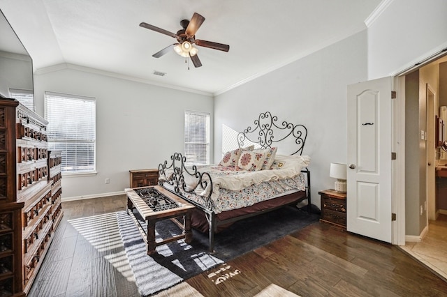 bedroom with multiple windows, dark hardwood / wood-style flooring, and ornamental molding