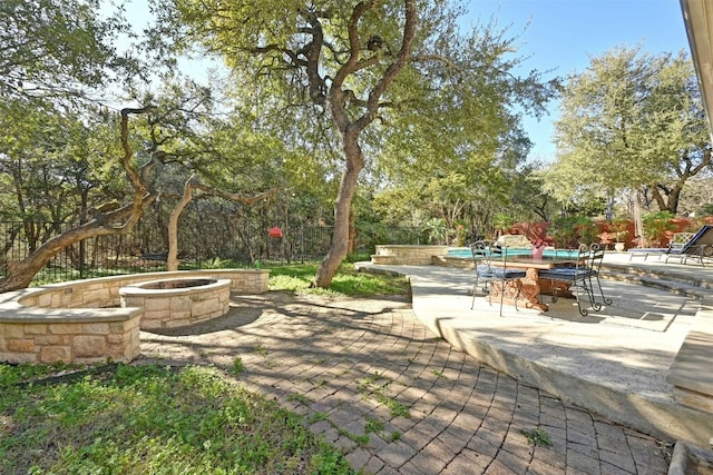 view of patio featuring an outdoor fire pit