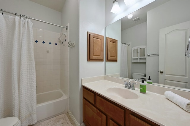 full bathroom with vanity, shower / bath combination with curtain, and toilet