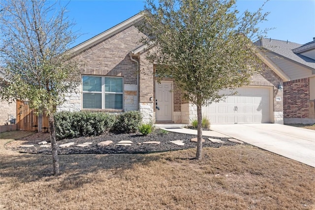 view of front of home featuring a garage and a front lawn