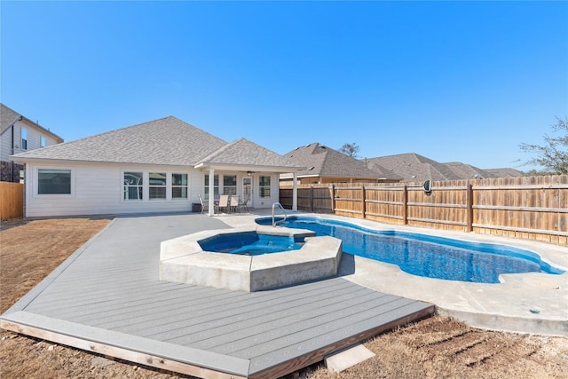 view of pool with an in ground hot tub