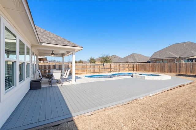 view of pool featuring an in ground hot tub and ceiling fan