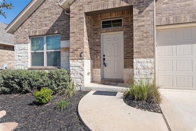 property entrance with a garage