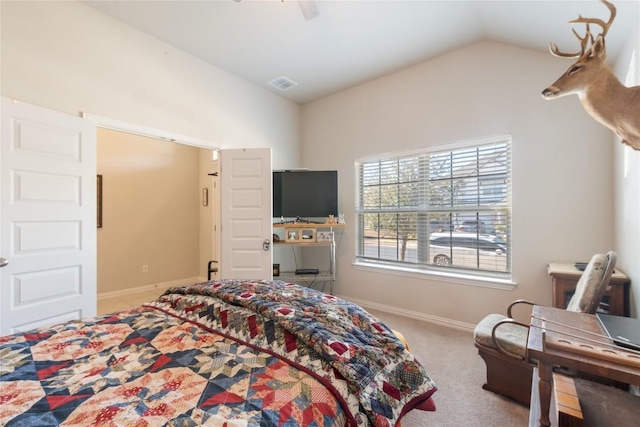 bedroom with vaulted ceiling, light carpet, and ceiling fan