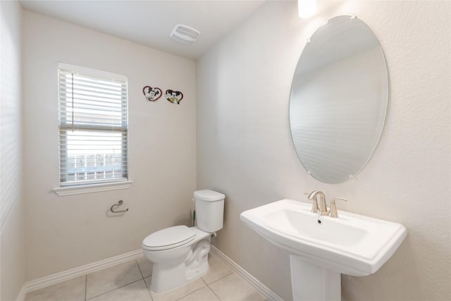 bathroom featuring sink, tile patterned floors, and toilet