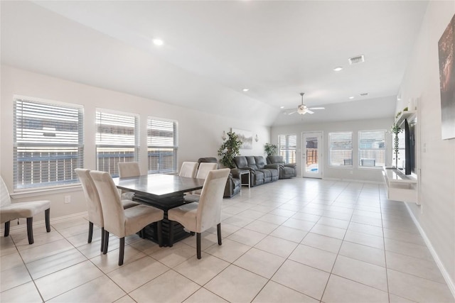 tiled dining room featuring vaulted ceiling and ceiling fan