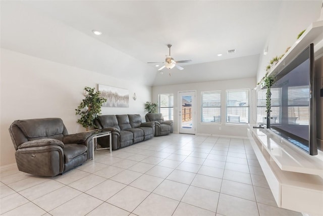 living room with vaulted ceiling, ceiling fan, and light tile patterned flooring