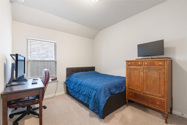 carpeted bedroom with vaulted ceiling