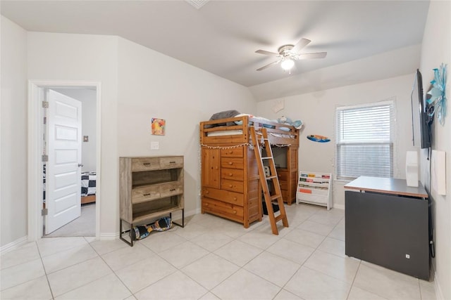 tiled bedroom with ceiling fan